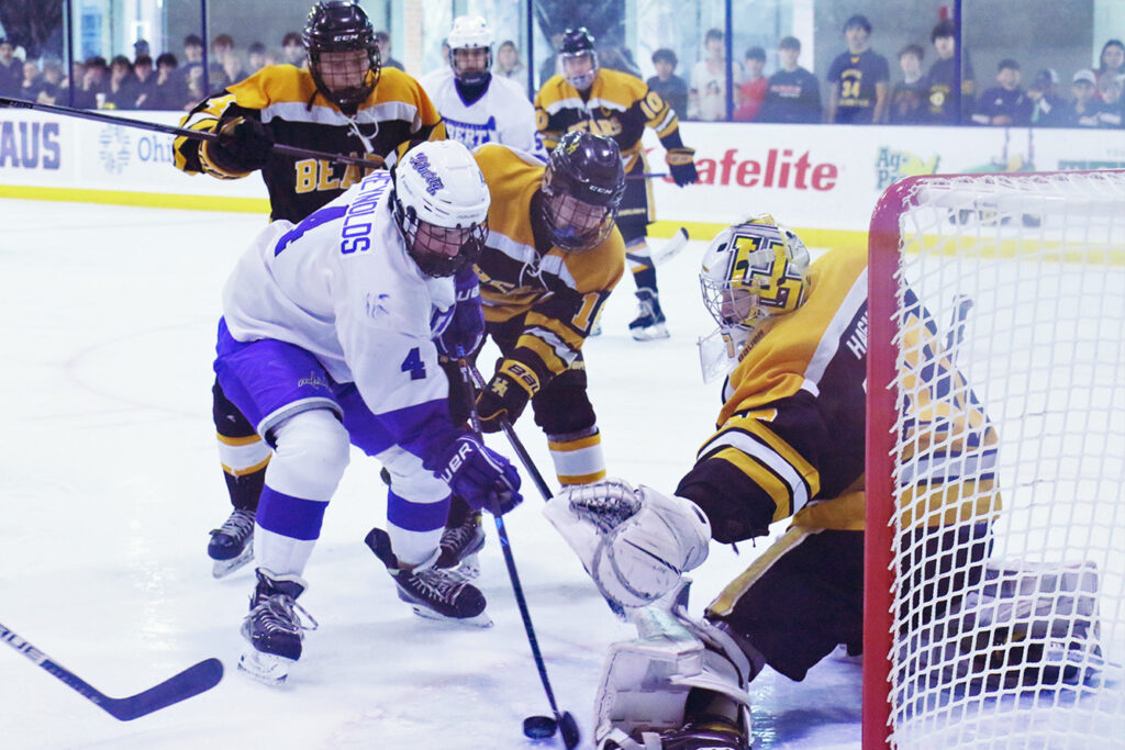 Liberty hockey team tries to score on Upper Arlington