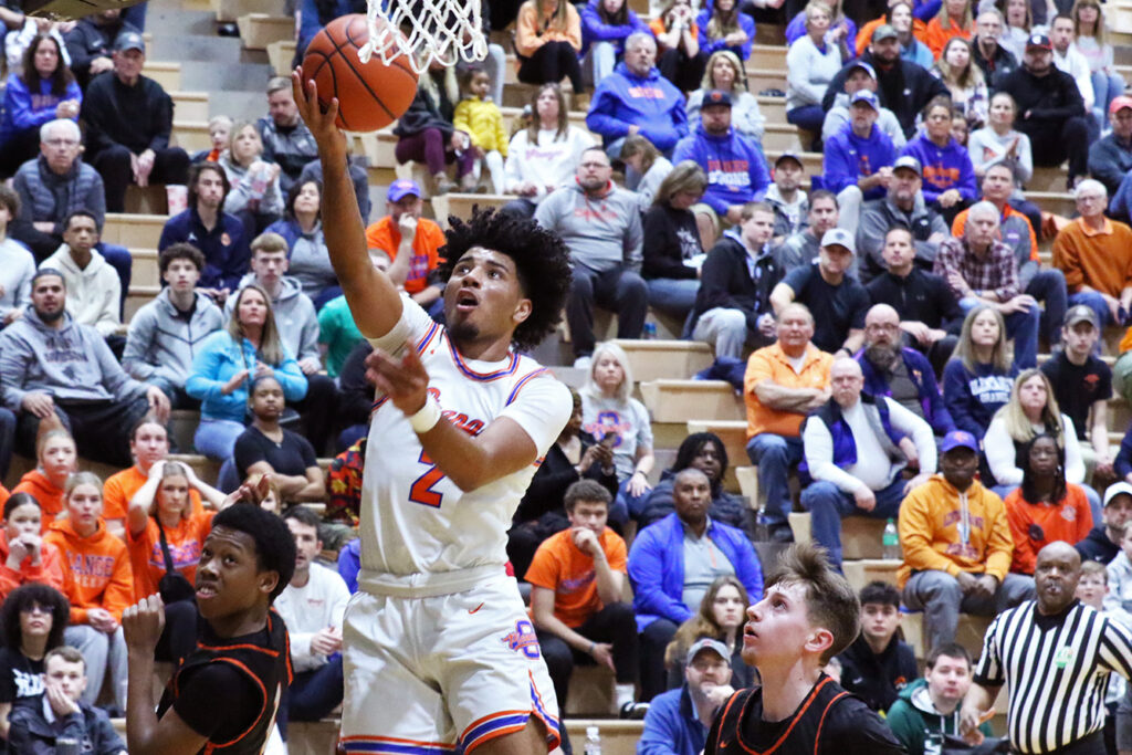 Olentangy Orange player Jordan Edwards lays up basketball