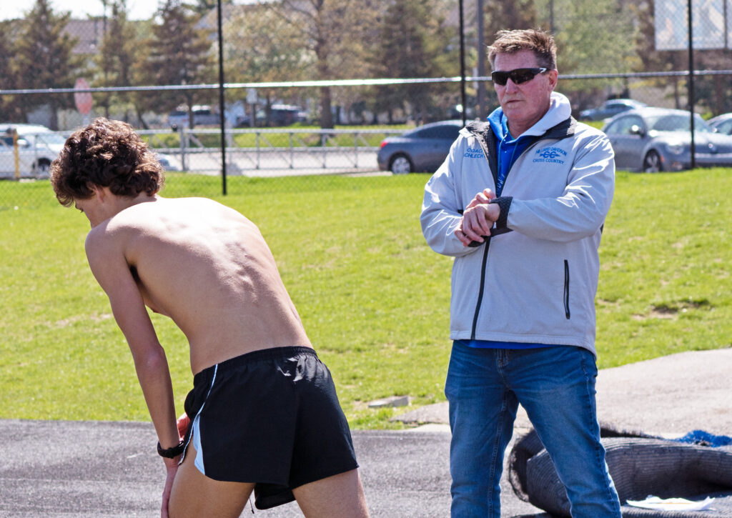 Hilliard Davidson track coach Pat Schlecht times runners