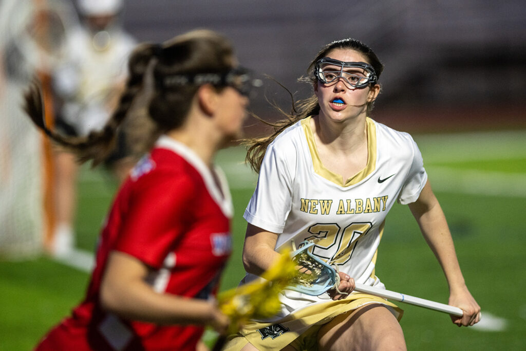 New Albany's Caroline Siegfried defends in lacrosse