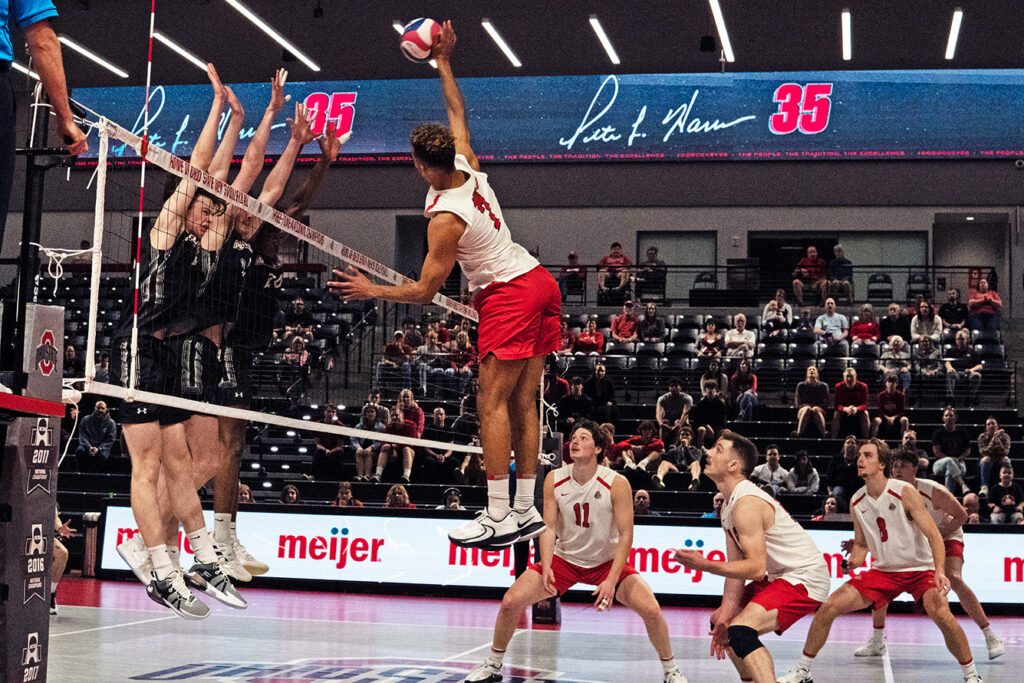 OSU's Jacob Pasteur spikes the volleyball