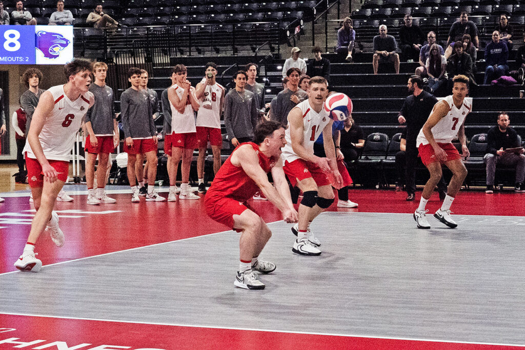 OSU's Thomas Poole digs the volleyball