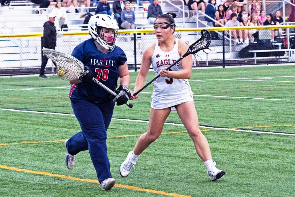 Watterson's Meg Newcombe defends in lacrosse