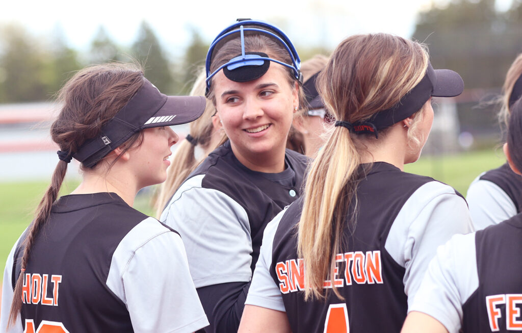 Delaware Hayes' Lauren Tompkins talks with teammates