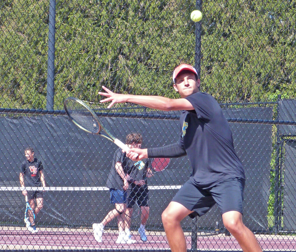 Gahanna's Brandon Carpico prepares to return tennis ball