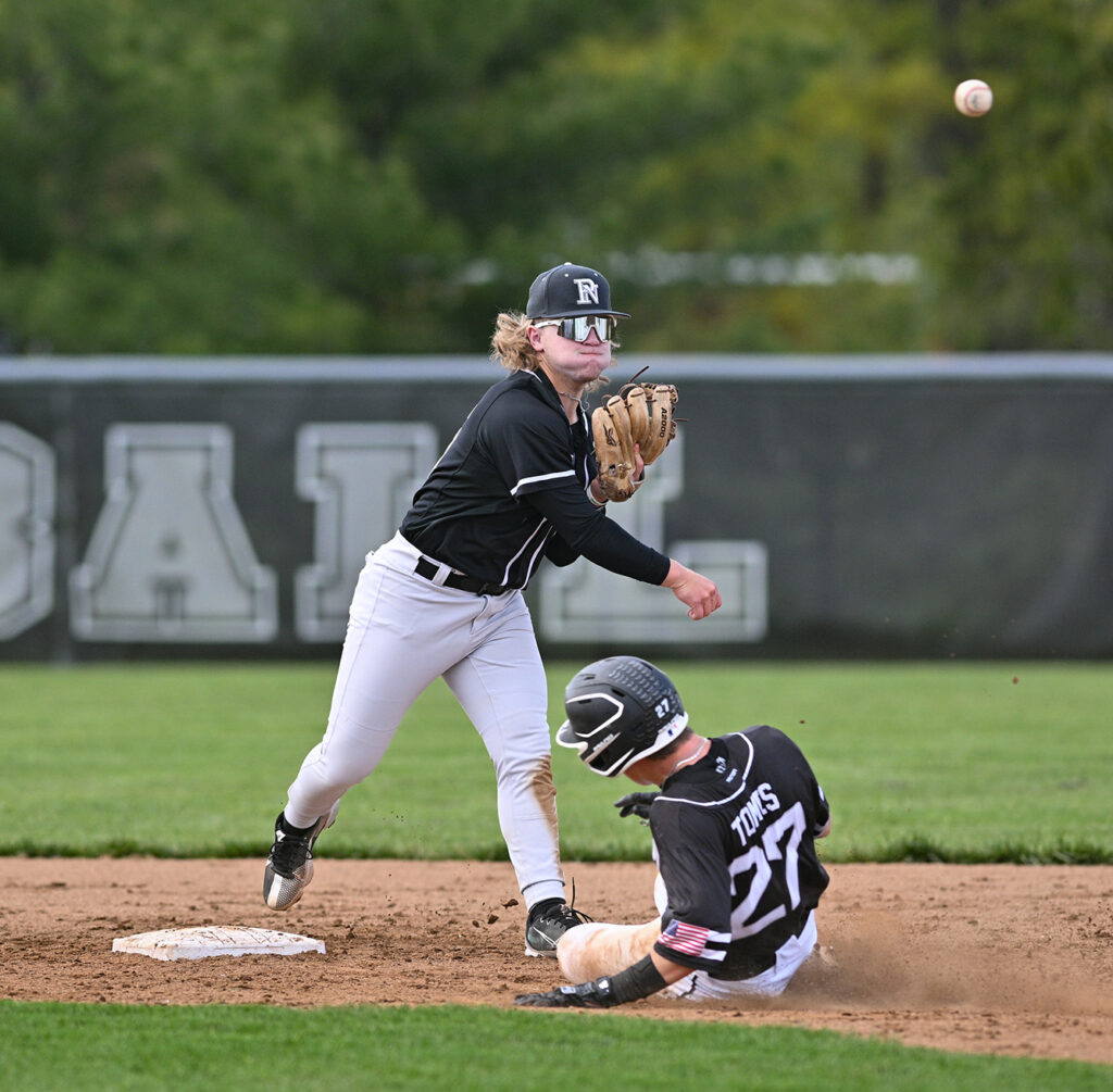 Pickerington North's Brett Madison throws to first