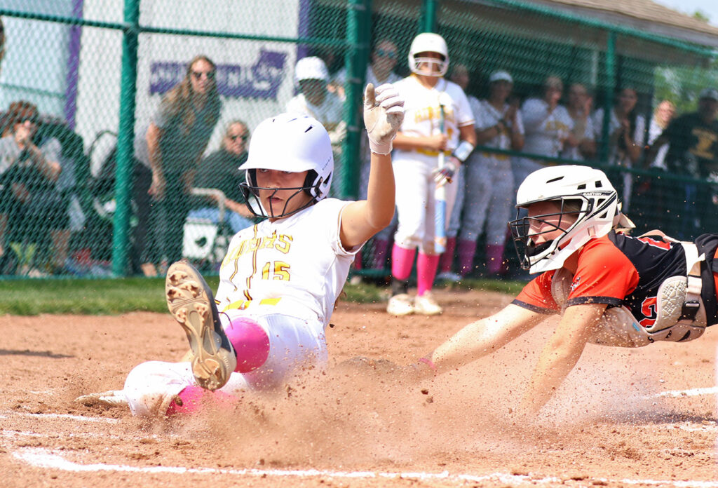 West Jefferson's Brooke Mannon slides in for run