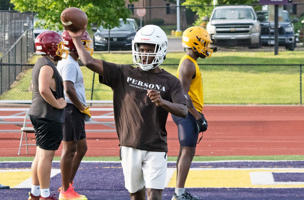 Linden McKinley's Chris Towns throws football