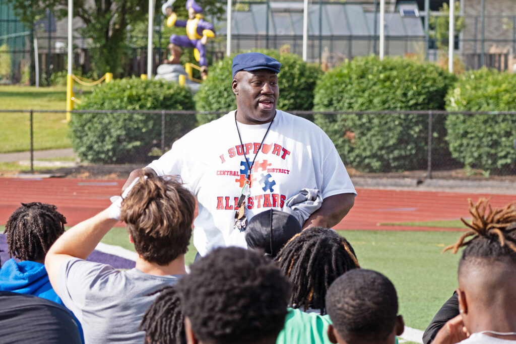 All star game organizer Jumbo Harrell talks to players