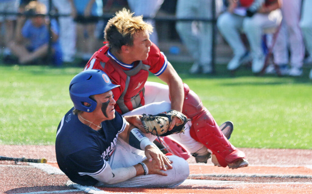 Grove City catcher Grady Speegle tags runner out