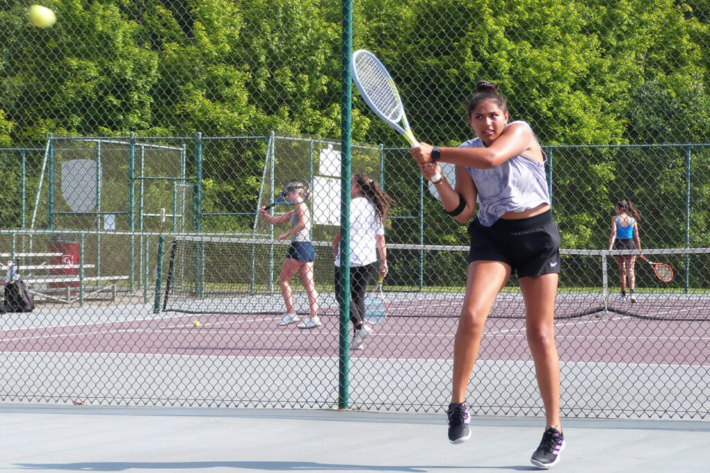 Columbus Academy tennis player Arya Chabria hits