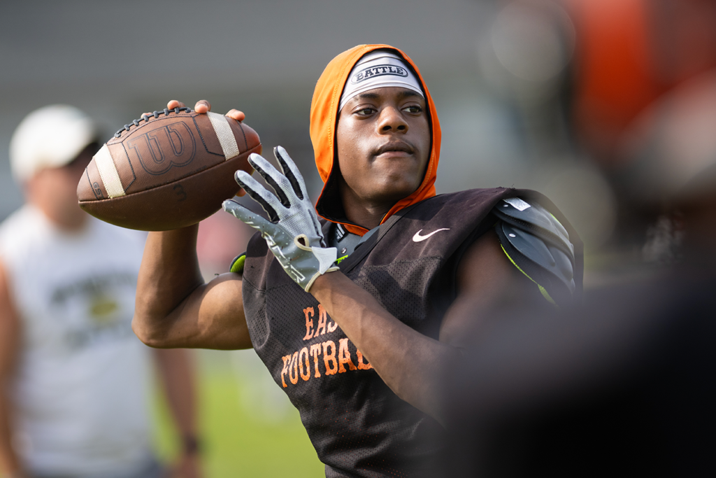 Columbus East quarterback Taizaun Burns warms up