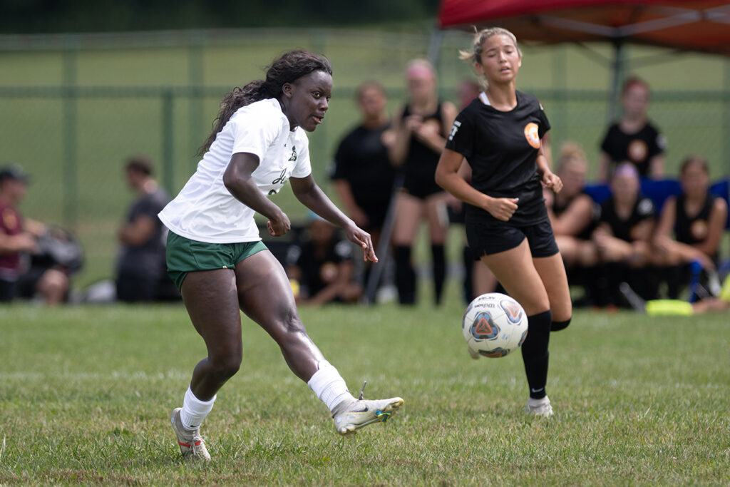 Dublin Jerome's Imani Kissi kicks soccer ball