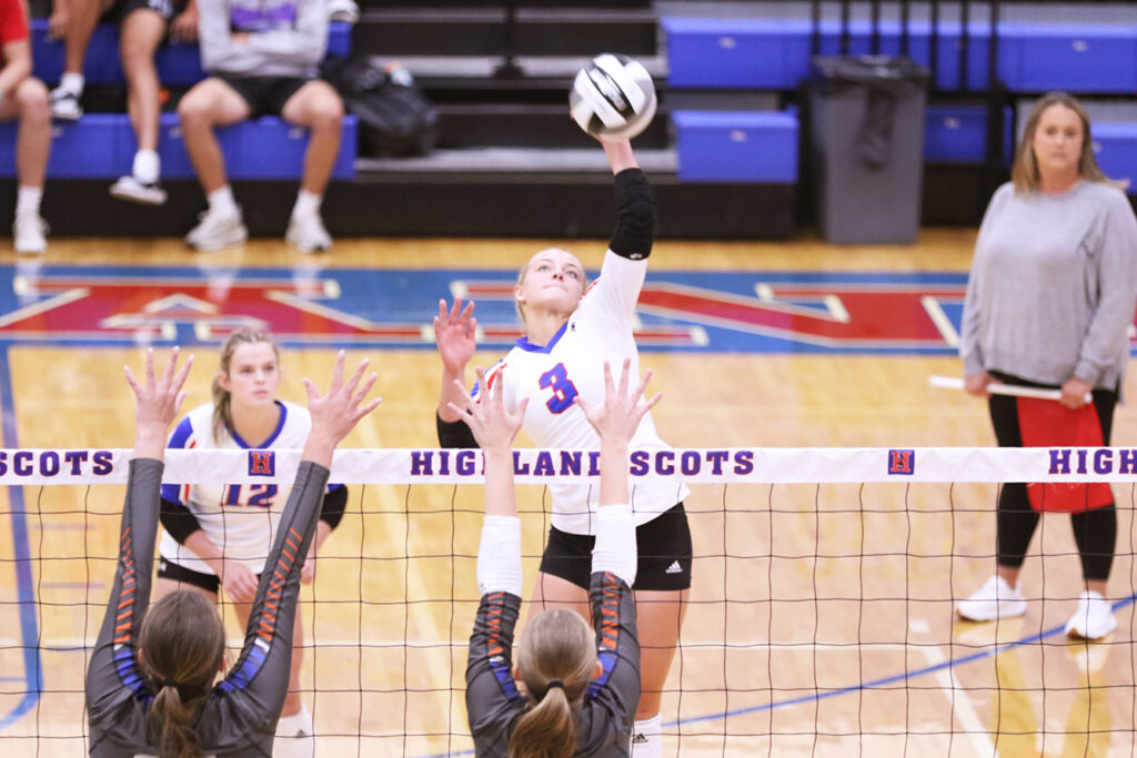 Highland's Kameron Stover spikes volleyball