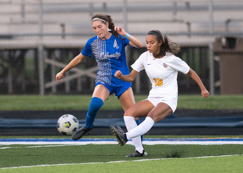 Olentangy Liberty's Ava Petrucci and Olentangy's Kareena Wardlow battle for soccer ball