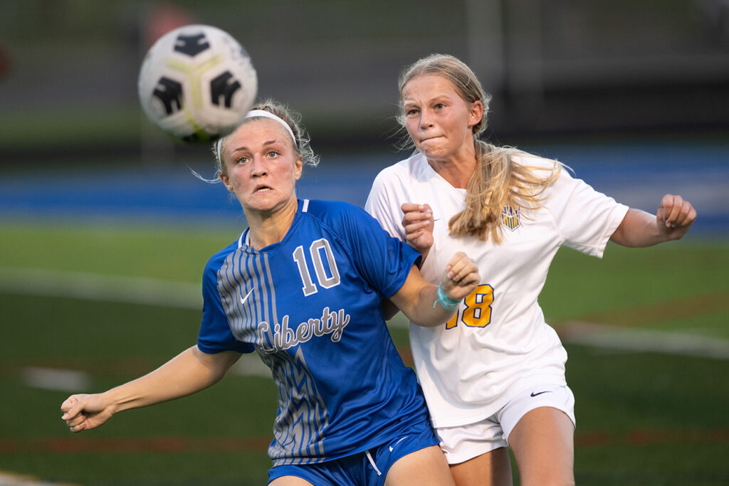 Olentangy Liberty's Chloe Brecht and Olentangy's Addi Moore battle for soccer ball