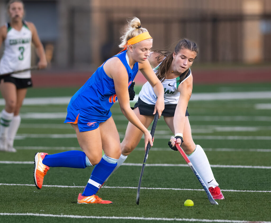 Olentangy Orange and Dublin Coffman field hockey players battle