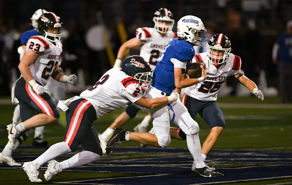 Hilliard Davidson’s Johnny DiBlasio runs football