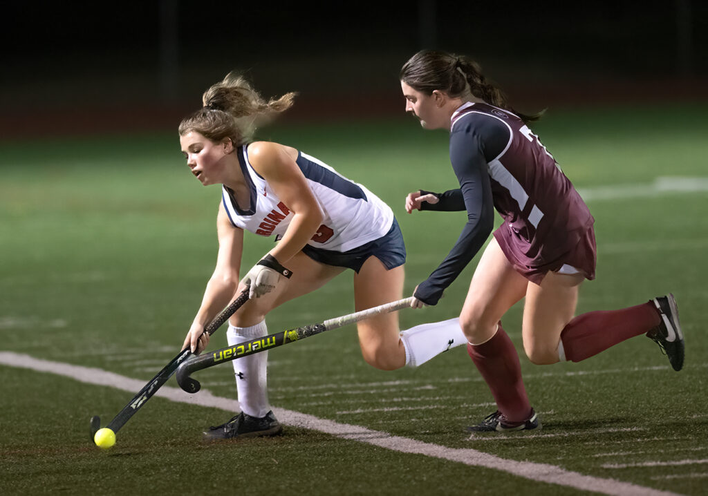 Thomas Worthington's Caroline Sprung moves with field hockey ball