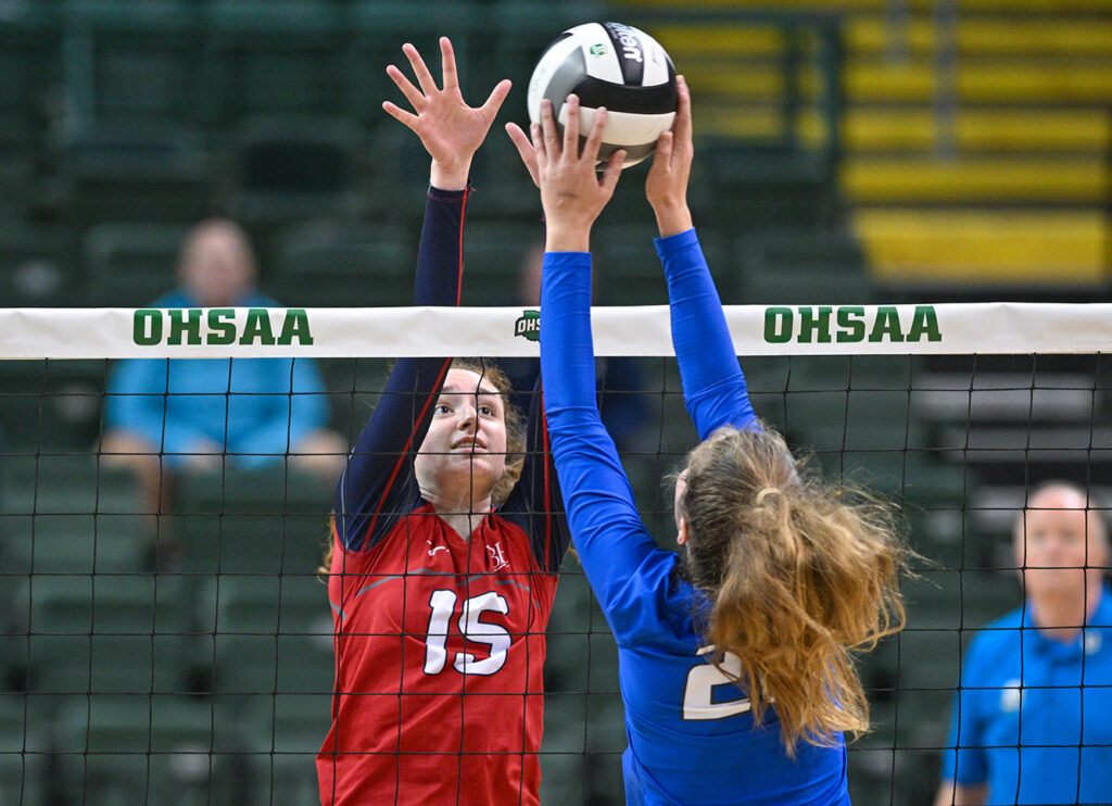 Hartley’s Michaela Muray blocks volleyball at net