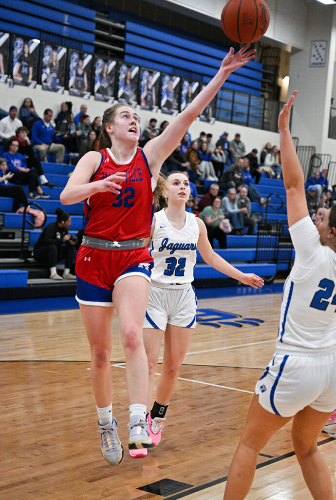 Marysville’s Allison Price lays up basketball