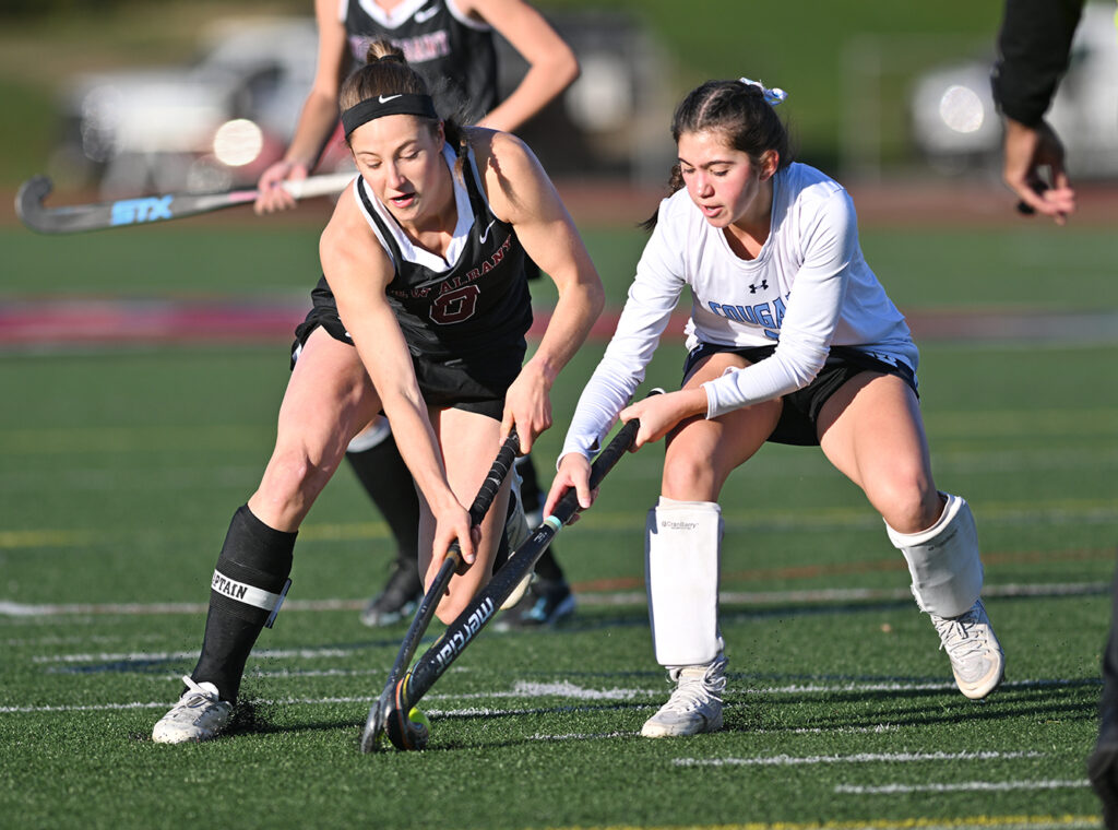 New Albany’s Ellie McClelland battles in field hockey match