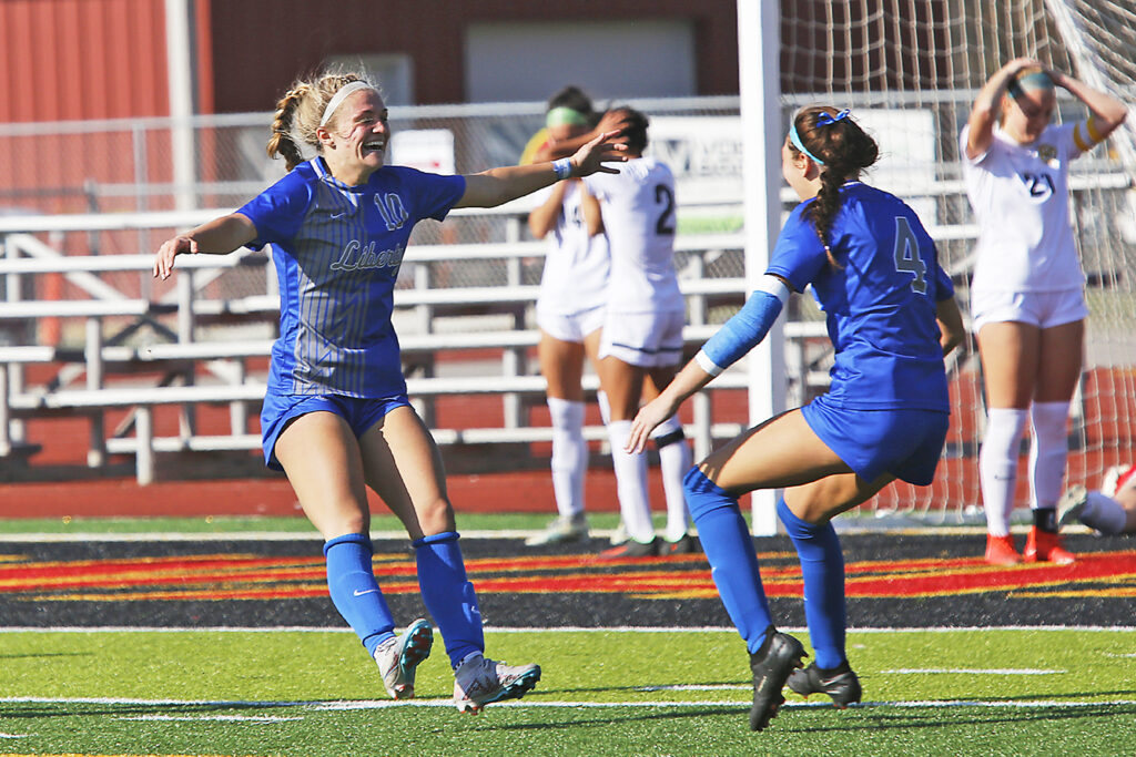 Olentangy LIberty teammates celebrate victory