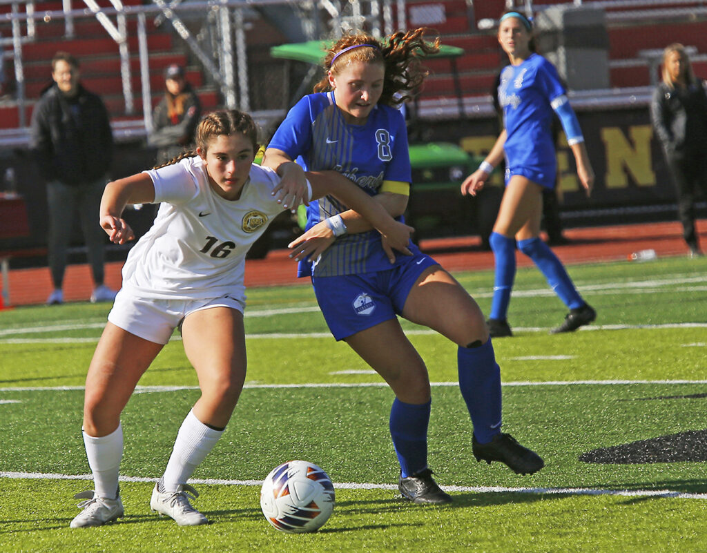 Upper Arlington and Olentangy Liberty soccer players battle for ball