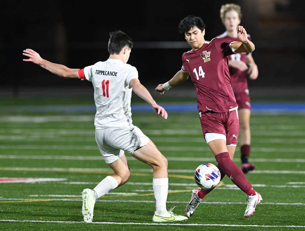 Bishop Watterson’s Dillon Brown battles for soccer ball