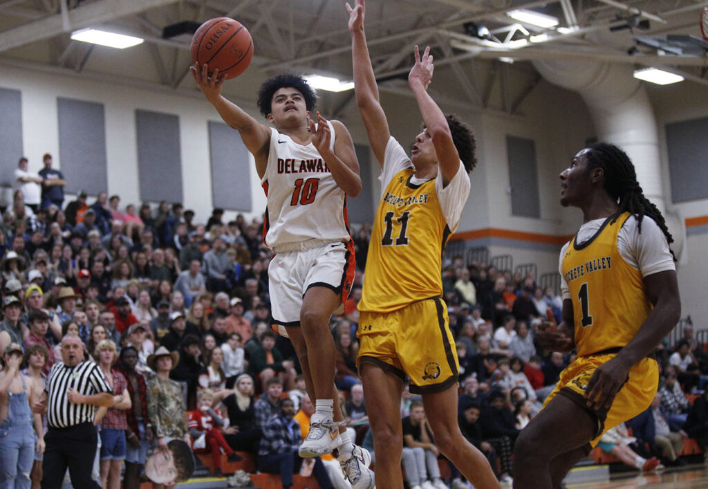 Delaware's Cobe Holmes drives to basket