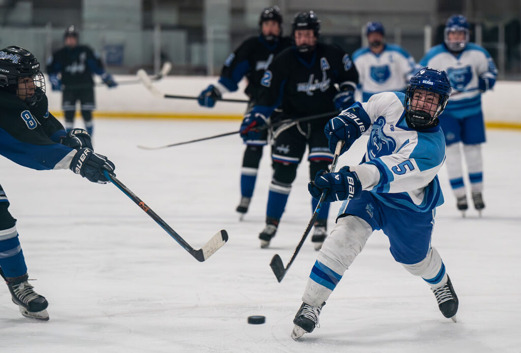 Olentangy Berlin's Myles Edgson shoots puck