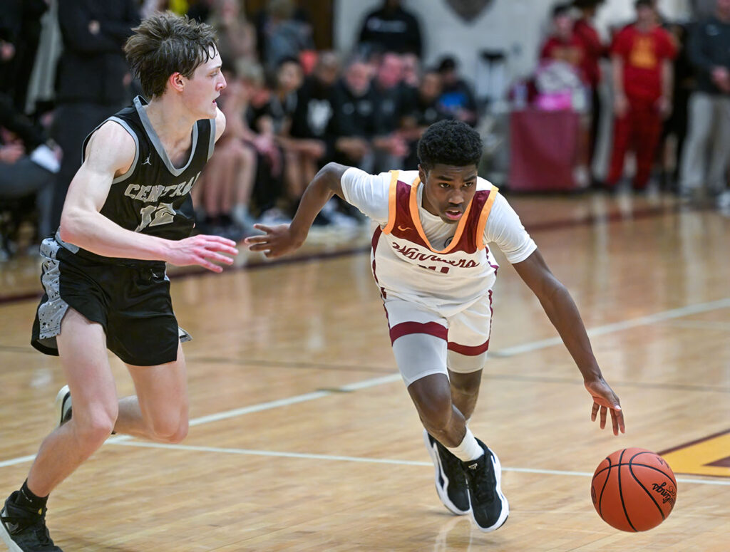 Westerville North’s Tyson Perkins drives with basketball