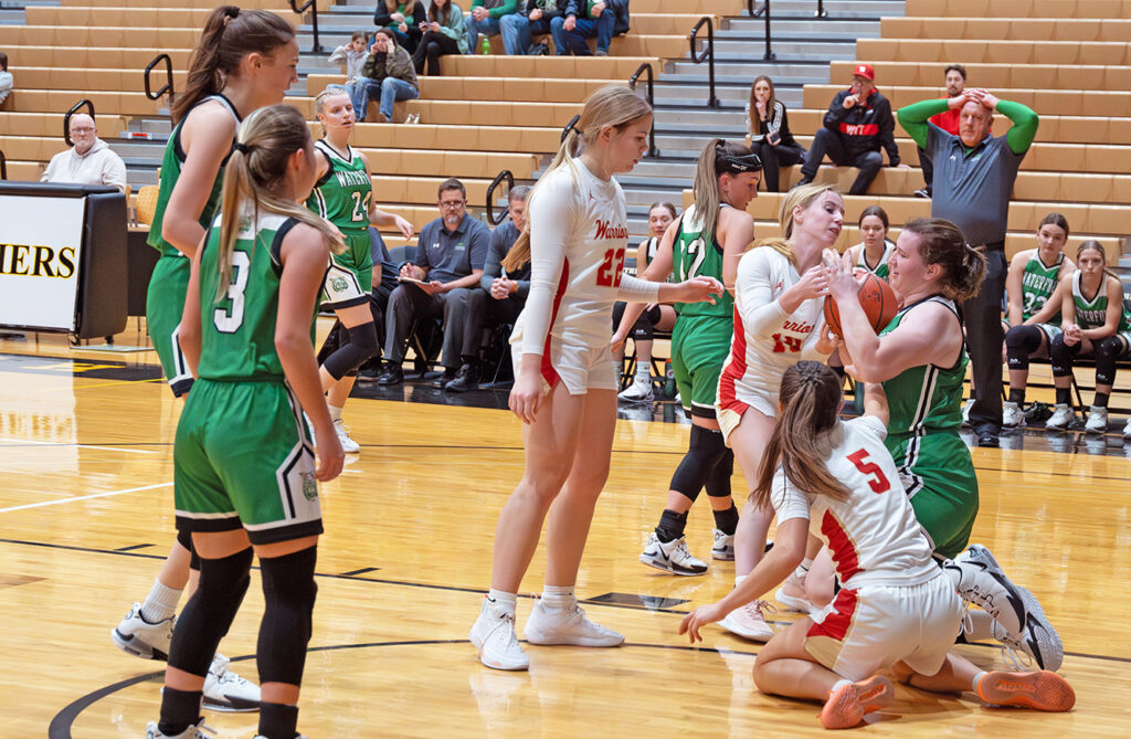 Worthington Christian's Natalie Woodfin battles for loose ball.