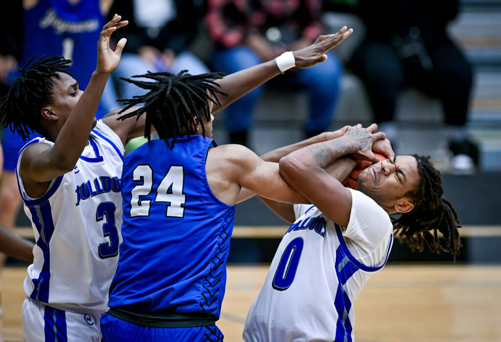 Columbus South’s Maurice McCall battles for loose ball