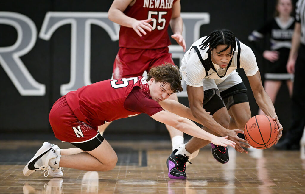 Newark’s Ty Gilbert battles for loose ball