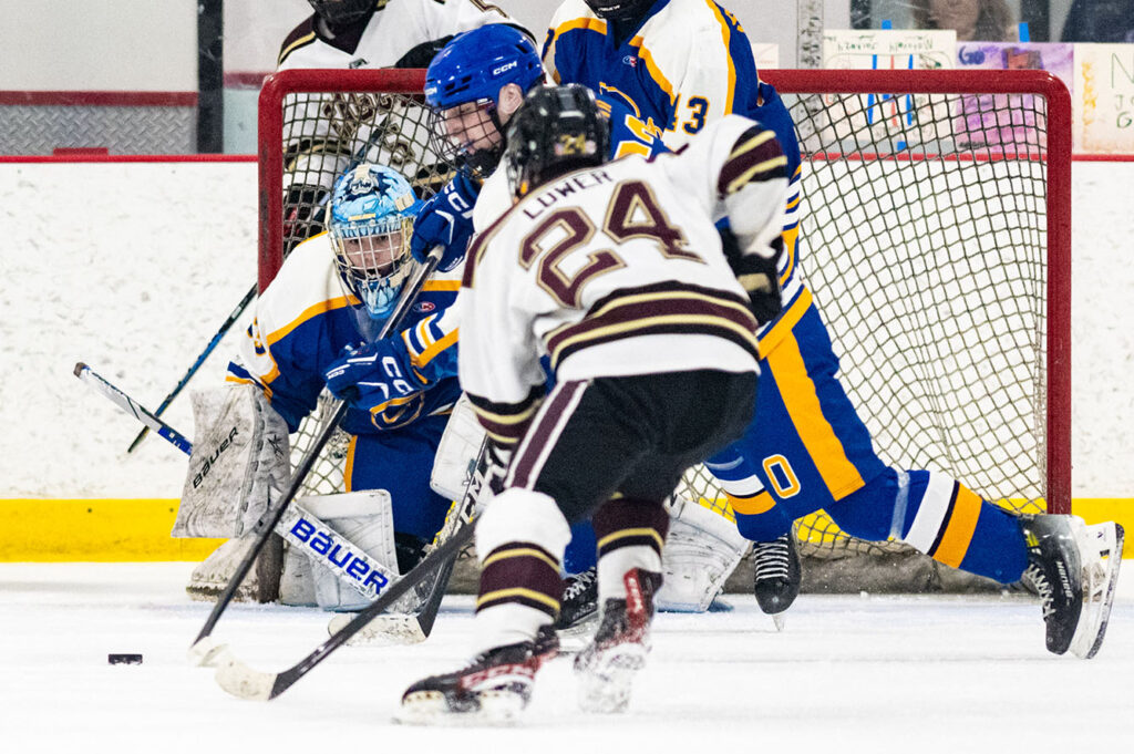 Olentangy goaltender Landon Ramsier peeks