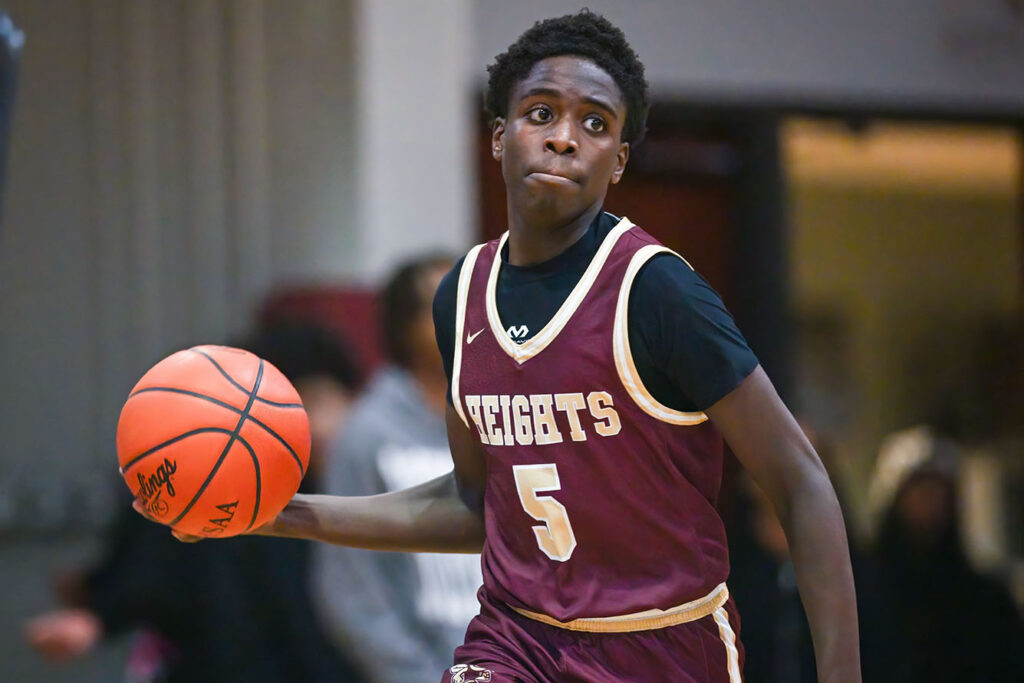 Licking Heights’ Alieu Ceesay moves with ball