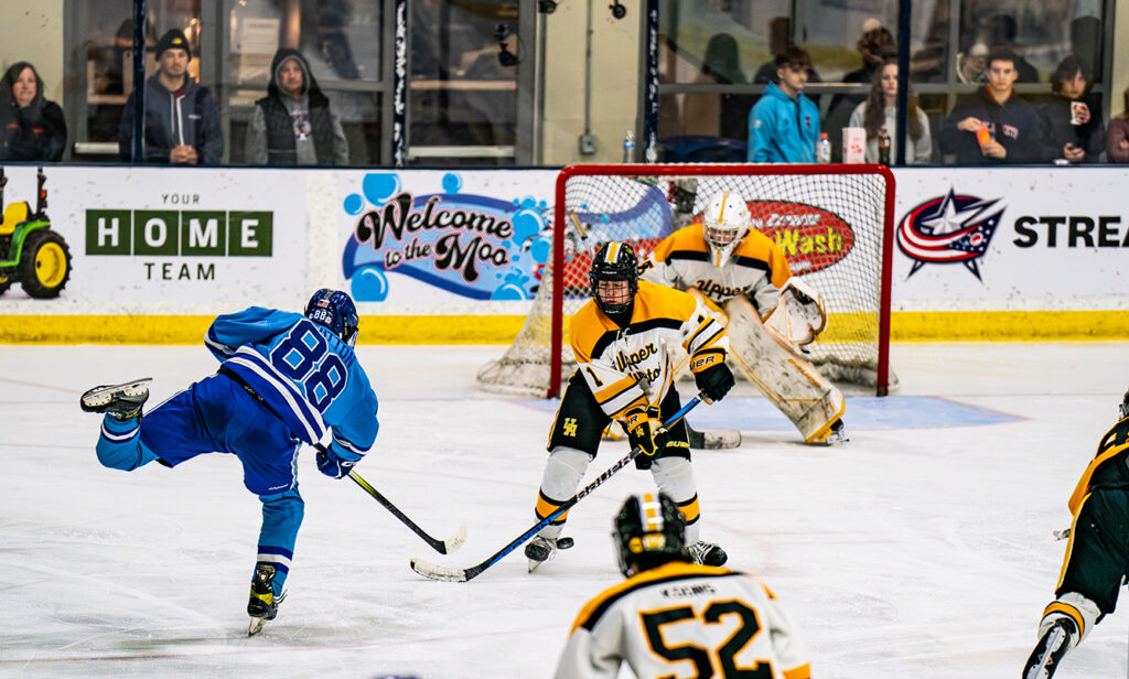 Olentangy Berlin's Nick Patton shoots puck