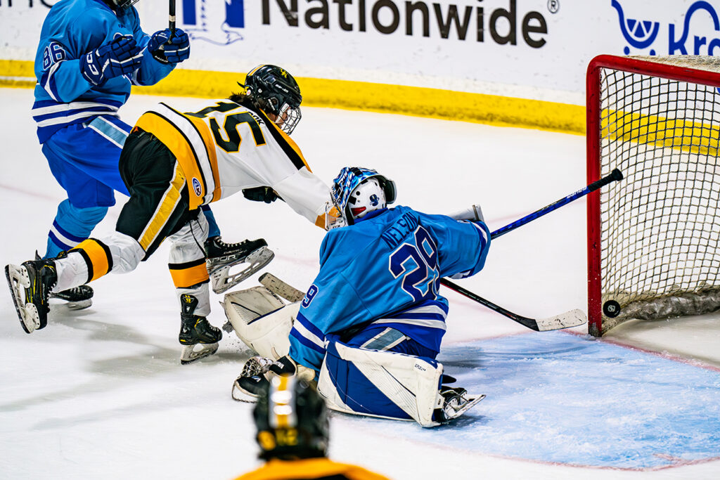 Upper Arlington's Tate Rook chips shot in