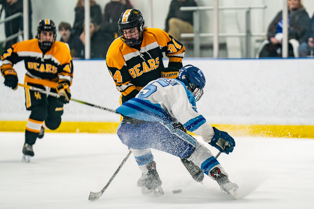 Upper Arlington's Zachary Teague battles on the ice