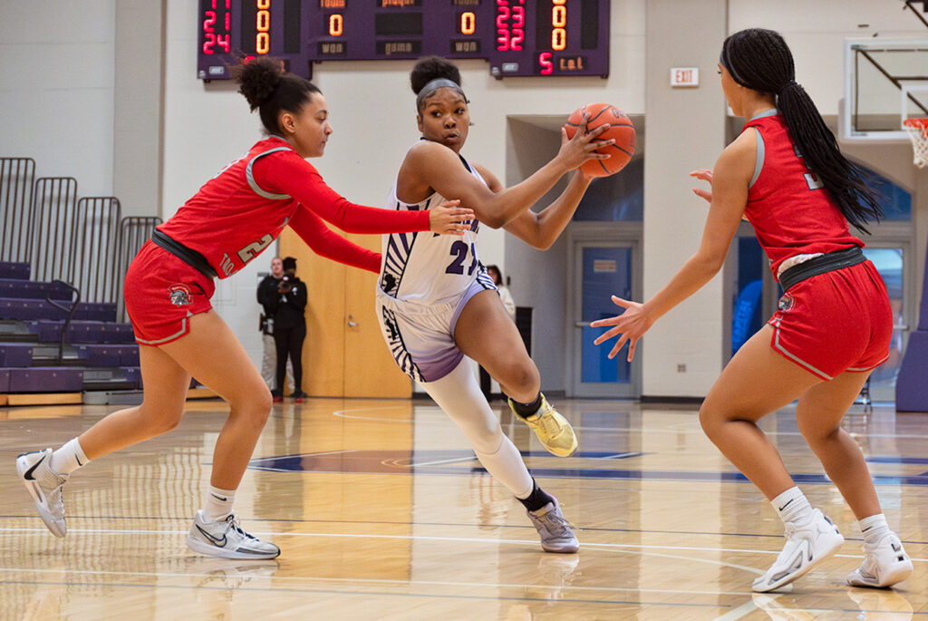 Africentric's Natiah Nelson drives to the basket