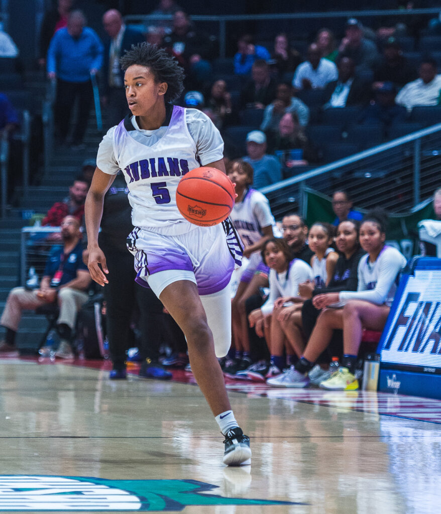 Africentric's Samairah Thompson dribbles upcourt