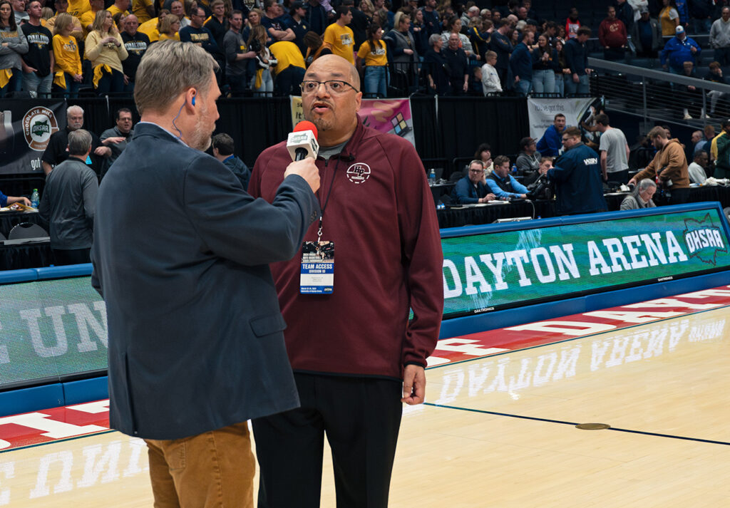 Harvest Prep head coach David Dennis Sr. being interviewed