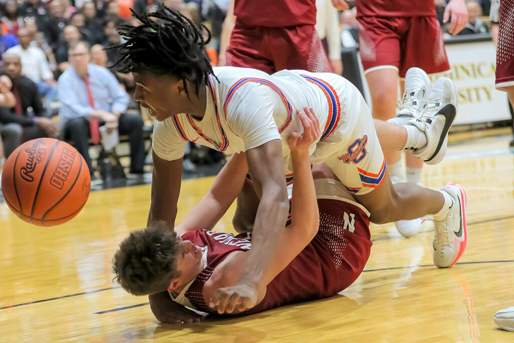 Olentangy Orange's Levi Davis falls on court