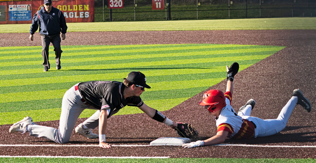 Big Walnut's Jax Lawrence dives back into first base