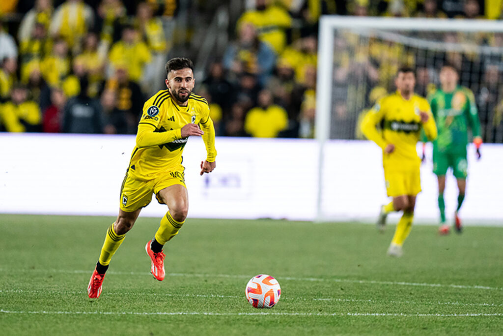 Crew's Diego Rossi dribbles in open pitch