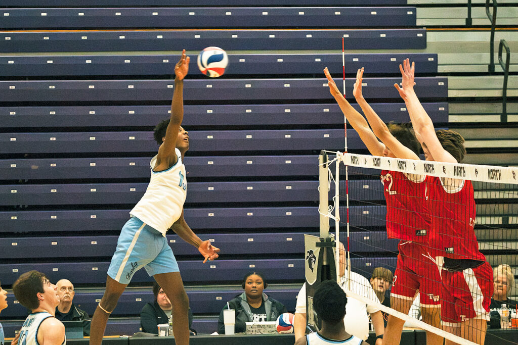 Hilliard Darby's Chris Jones hits at the net