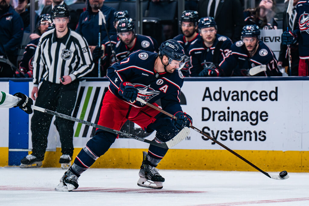 CBJ's Sean Kuraly skates with puck