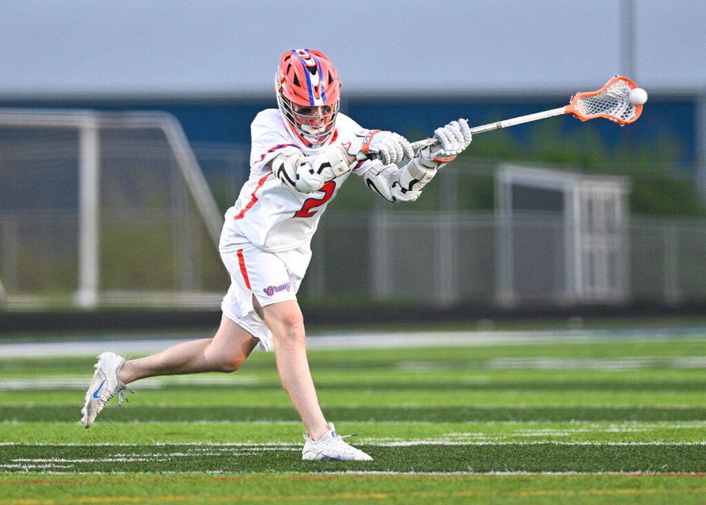 Olentangy Orange's Cohen Sayre shoots lacrosse ball
