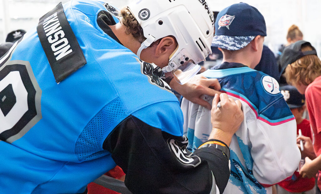 CBJ Cam Atkinson signs jersey at CapCity